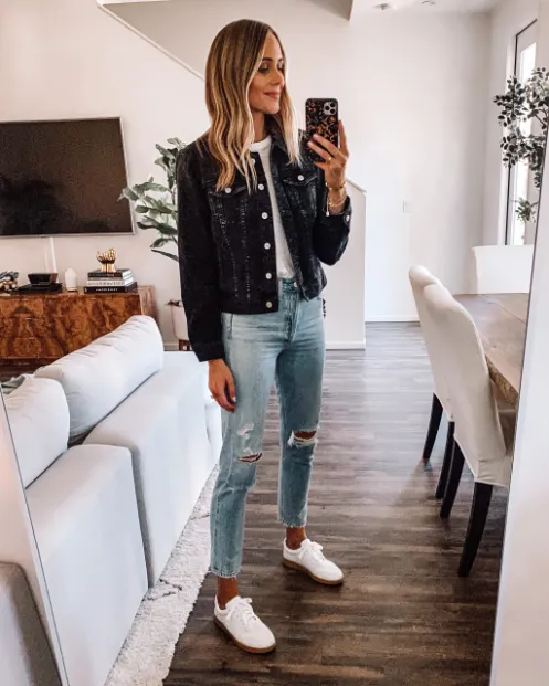 Pairing a Black Denim Jacket with Ripped Jeans and Sneakers