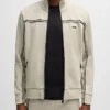 Buy Now Maurice Johnson Beyond The Gates 2025 Ted Richardson OFF-White Zip-Up Track Jacket For Unisex