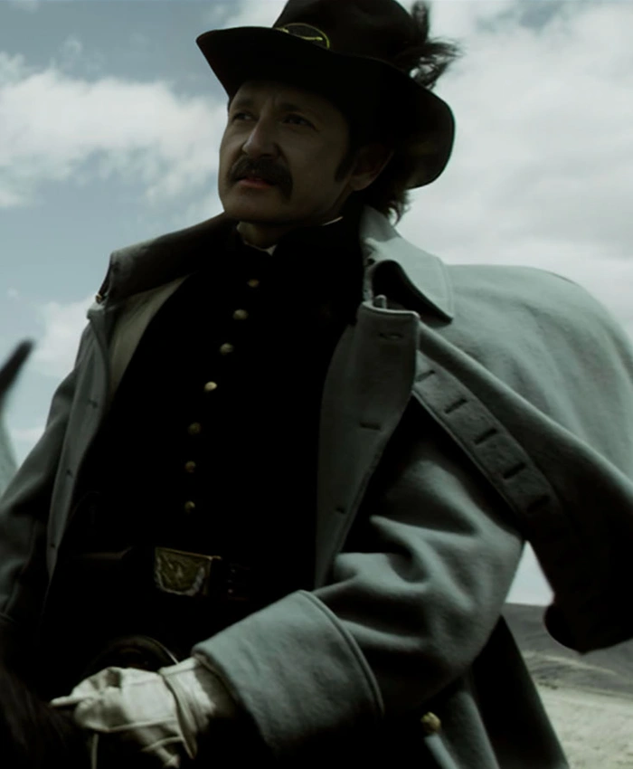 Alternative view of American Primeval 2025 Lucas Neff Grey Coat